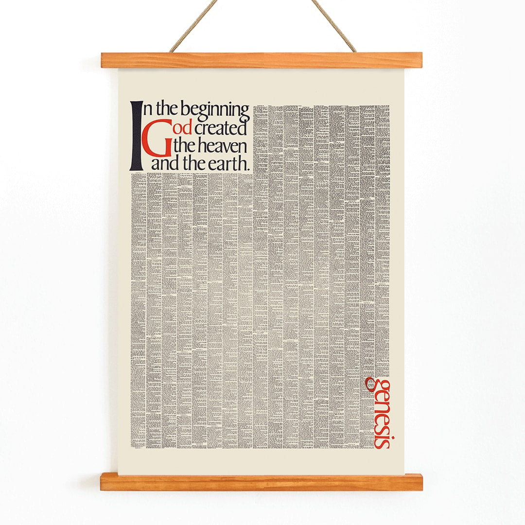 Genesis typography artwork and poster by Herb Lubalin with text In the beginning God created the heaven and the earth featuring the first pages of Genesis, with wooden magnetic frame on white background