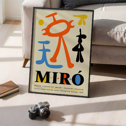 Exhibition poster inspired by Joan Miro and artwork Parler Seul featuring colorful abstract shapes and bold typography, framed and displayed in modern living room decor