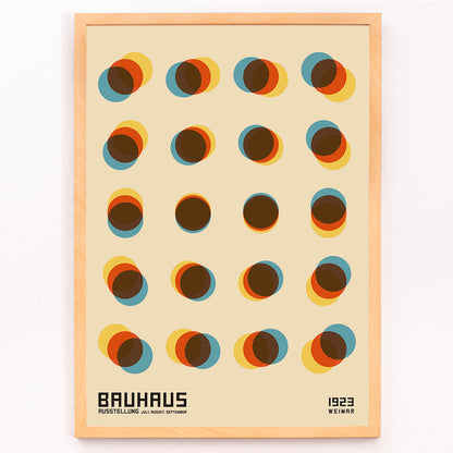 Bauhaus Poster 9 Inspired by the Weimar Exhibition with overlapping colorful circles in a geometric pattern on a beige background, framed and displayed in modern living room decor