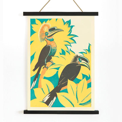 Colorful birds with vibrant plumage among yellow stylized foliage artwork by Clifford Webb from A Jungle Picnic Pl 07, with wooden magnetic frame on white background