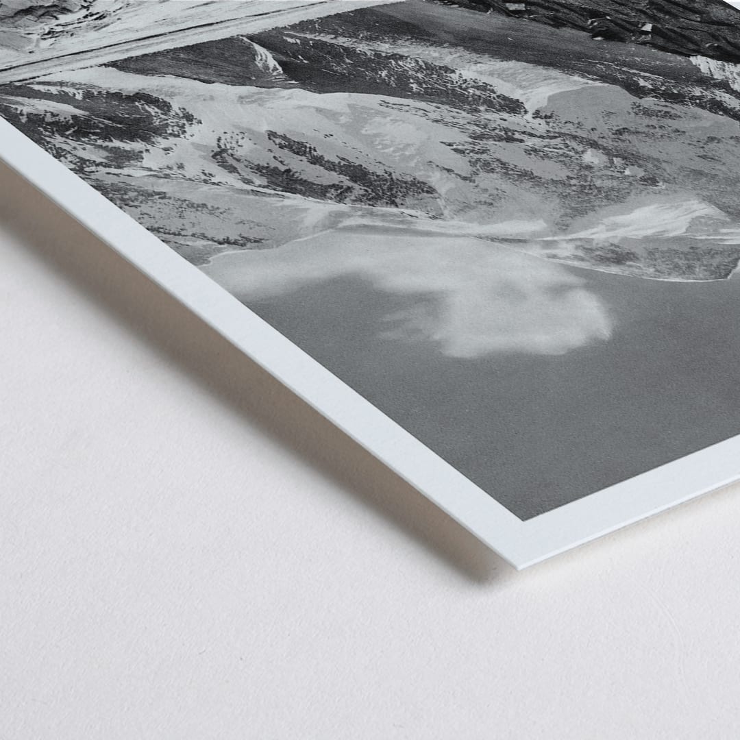 Closeup detail of Black and white photograph and poster of Broad Peak by Vittorio Sella showing snow covered mountains and mountaineers climbing amidst rocky terrain and glacier