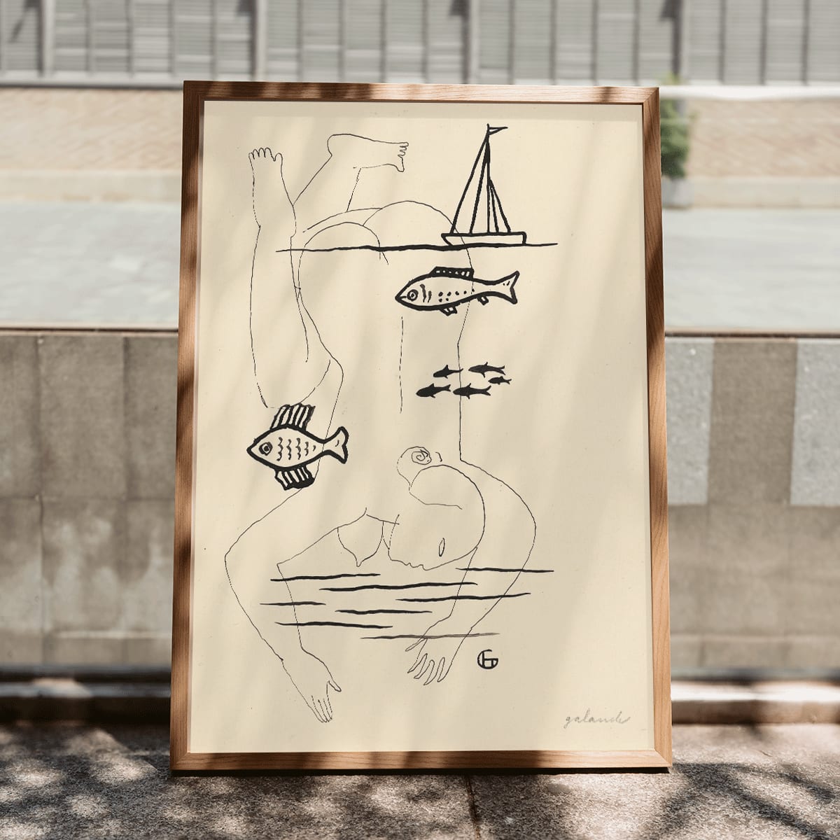 Drowned by Mikuláš Galanda surreal minimalist line drawing poster featuring abstract human figure fish and sailboat, framed and displayed in modern living room decor