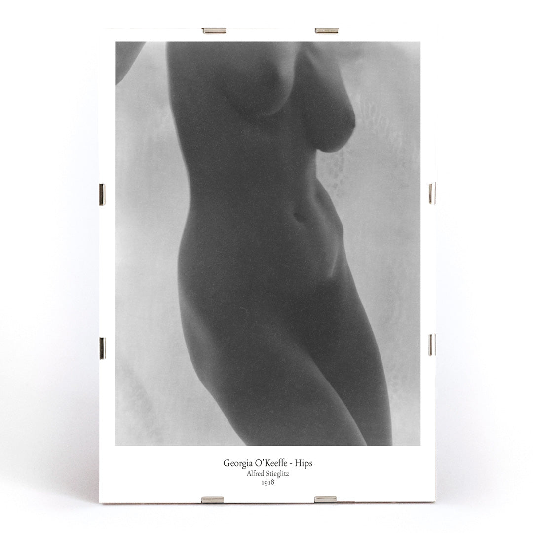 Black and white nude portrait of Georgia O Keeffe Hips by Alfred Stieglitz featuring torso photographic study poster, framed and displayed in modern living room decor