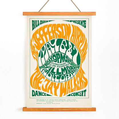 Psychedelic concert poster by Wes Wilson for The Jefferson Airplane and Jay Walkers at Fillmore Auditorium with vibrant orange and green text, with wooden magnetic frame on white background