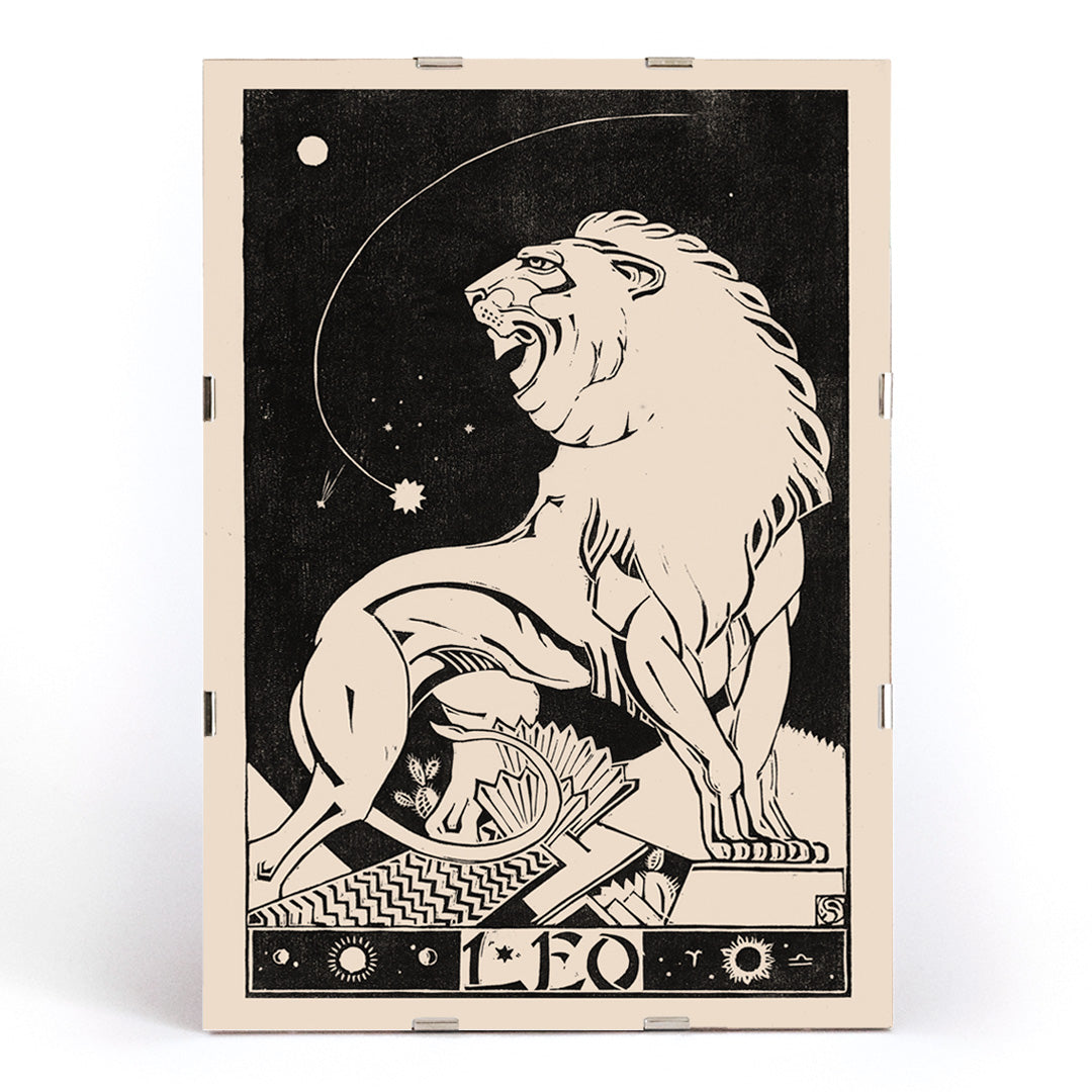 Art deco poster of a stylized roaring lion representing Leo zodiac sign by Henri van der Stok in black and white, framed and displayed in modern living room decor