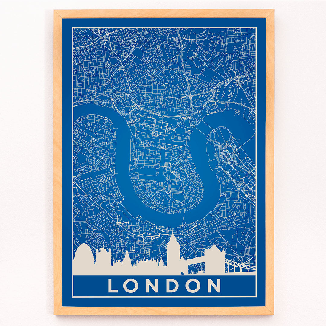 Minimalist London map artwork poster with blue background white map details by artist Anonymous featuring major landmarks, framed and displayed in modern living room decor