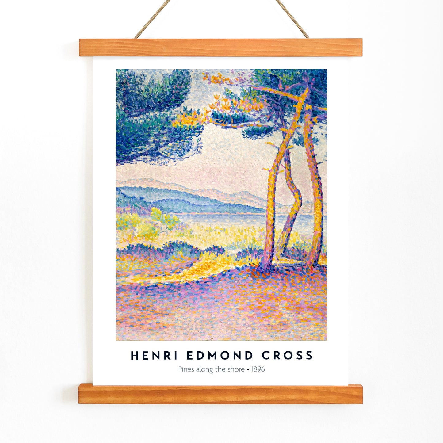 Colorful seascape poster of Pines Along the Shore by Henri Edmond Cross featuring vibrant pine trees and pointillist landscape, with wooden magnetic frame on white background