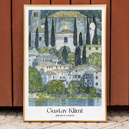 Kirche in Cassone by Gustav Klimt colorful village and church landscape painting poster with trees and buildings reflected in water, framed and displayed in home decor
