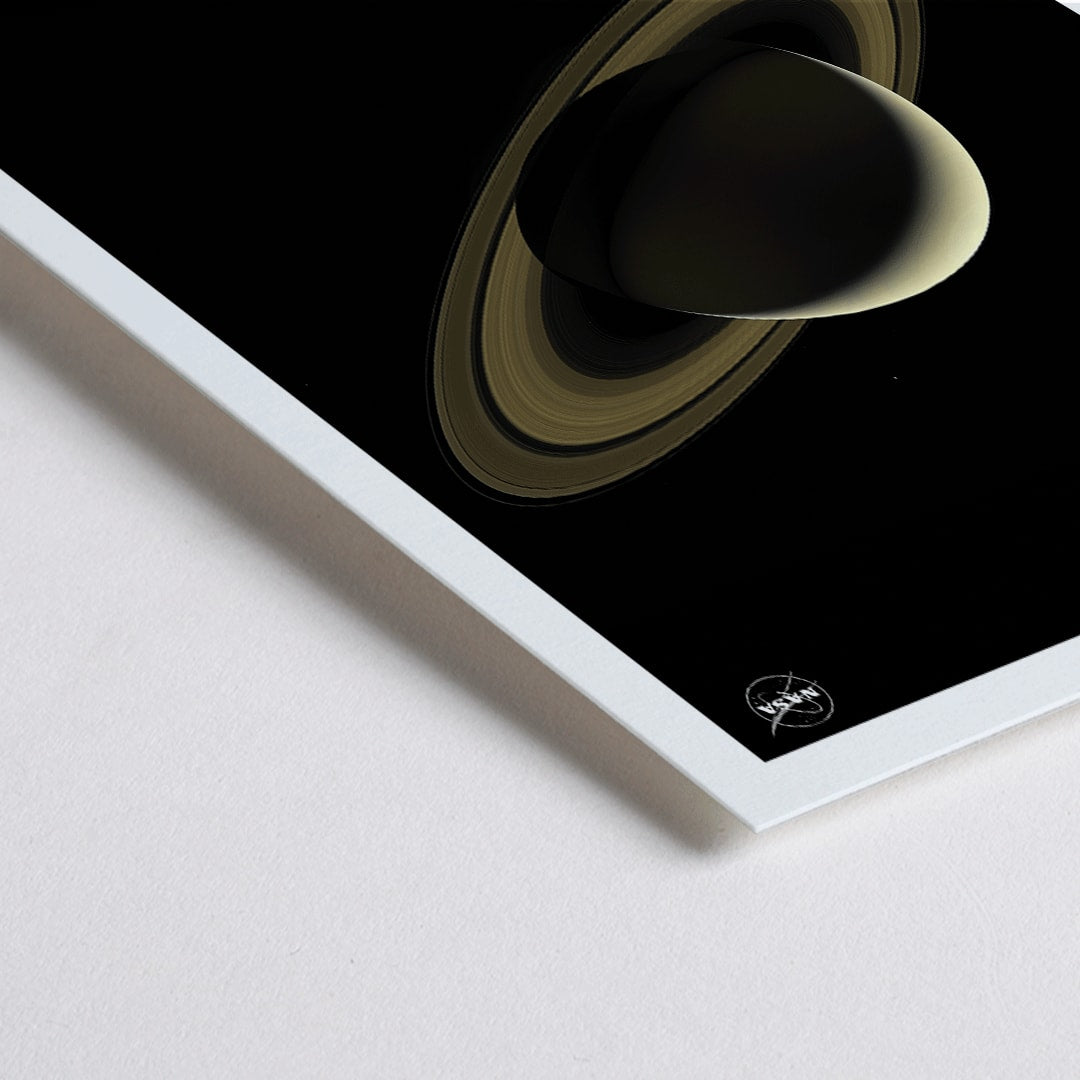 Closeup detail of NASA illustration and poster of planet Saturn with rings against black background