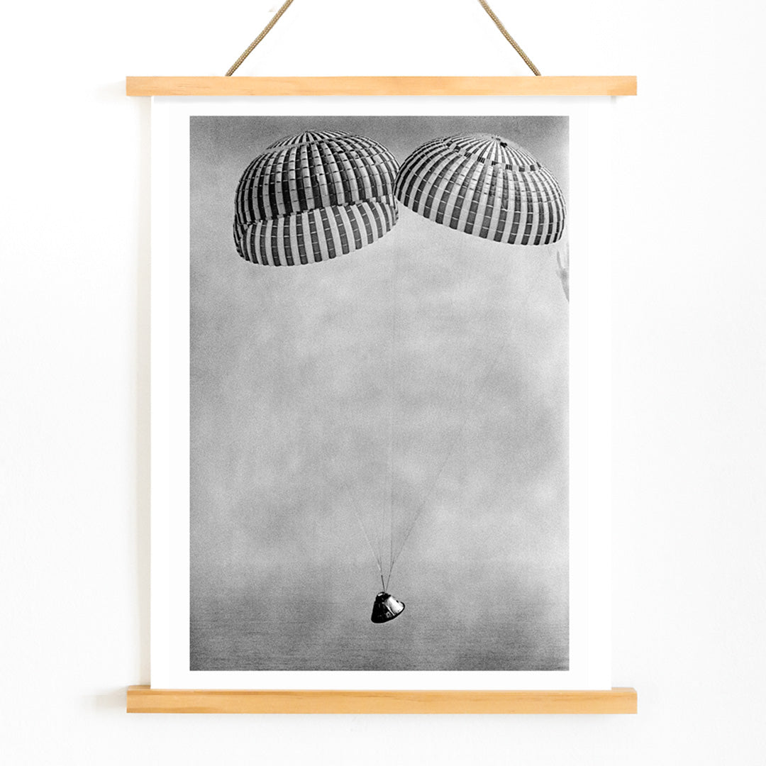 Apollo 9 spacecraft with astronauts McDivitt Scott and Schweickart descending toward Atlantic splashdown with parachutes NASA recovery poster, with wooden magnetic frame on white background
